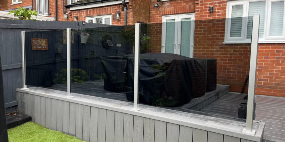 Screenshot Elegant aluminium glass balustrade with a top rail, enhancing both the safety and aesthetic appeal of a contemporary outdoor deck