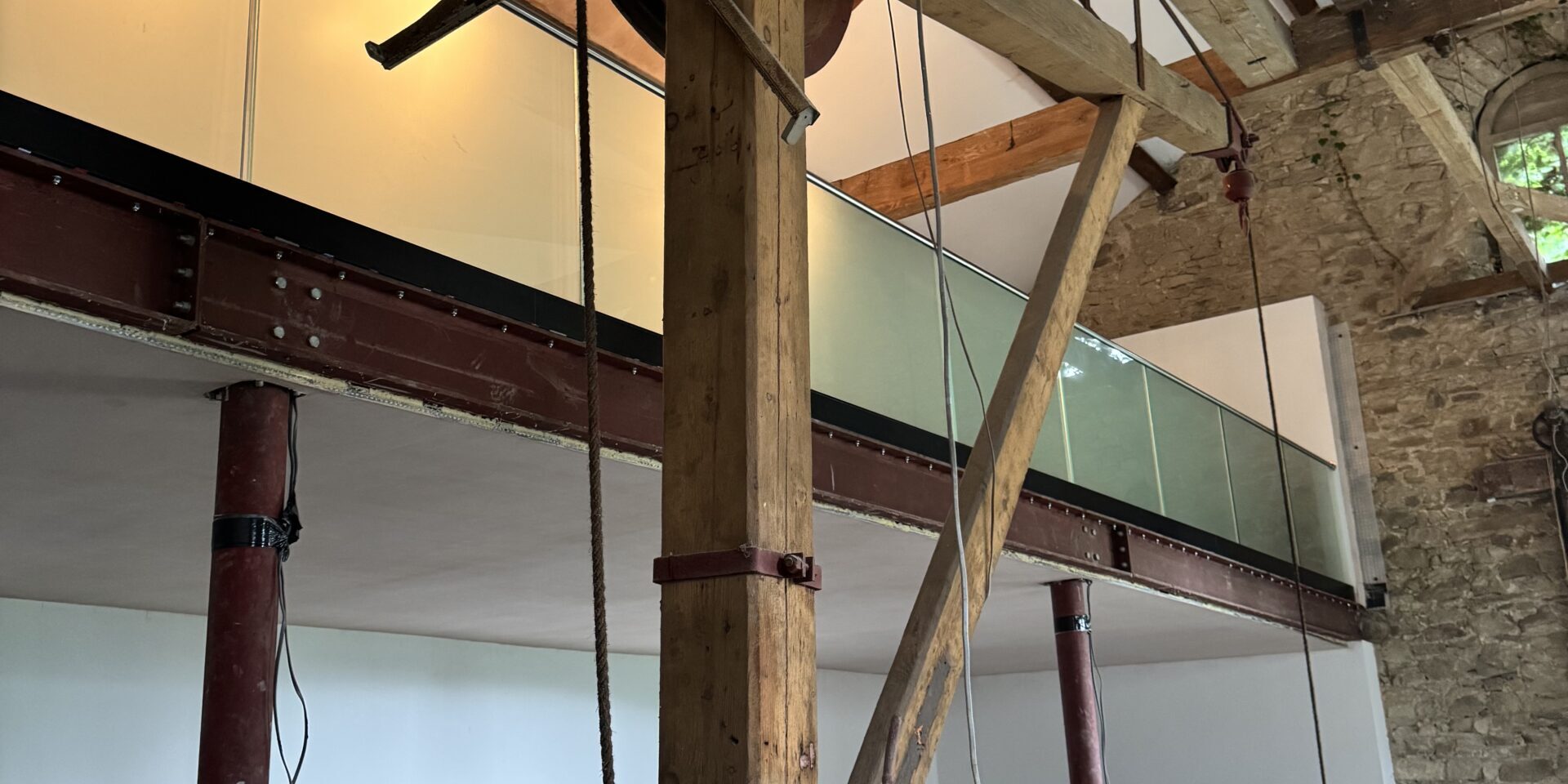 21.5mm toughened laminated glass balustrade installation at Grade II listed Summerseat Railway Goods Shed by NW Fabrications